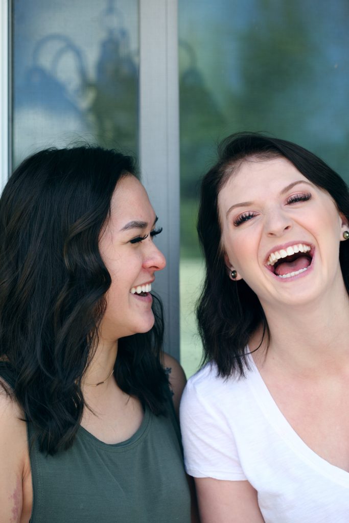 Two women in twenties laughing